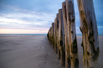 Groyne going out to Sea. Wooden poles in the Sea. France