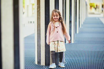 Fototapeta premium Girl running in Palais Royal garden
