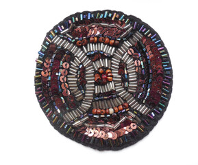 Homemade embroidery applique (the property of the author of the photo) made of multicolored beads (beads) and shiny glass beads.