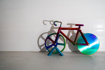 colorful bicycle and visible shadow, creative effect of sunlight, reflection on the wall, mirroring volume, healthy lifestyle, cardio exercise, fitness, children toy, sport
