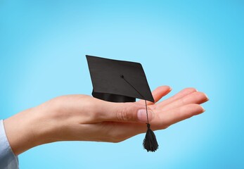 A doctor study learn with graduation gap hat in hand, clever bright genius education medicine concept.