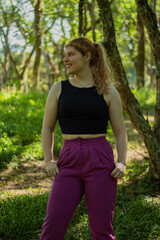 Fototapeta premium Smiling young girl in urban area