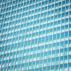 Fototapeta na wymiar Modern glass windows skycraper wall. Abstract background.