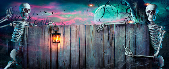 Fototapeta Halloween Party - Skeletons With Wooden Banner In Spooky Nights obraz
