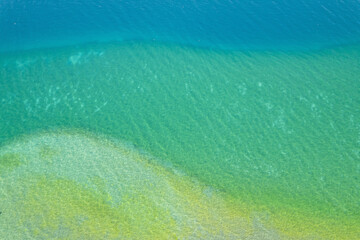 Fototapeta na wymiar Different colors of blue in Ohrid lake in Summer of bird view