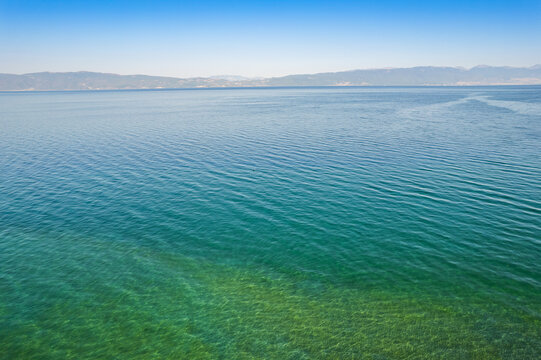 Different colors of blue in Ohrid lake in Summer of bird view