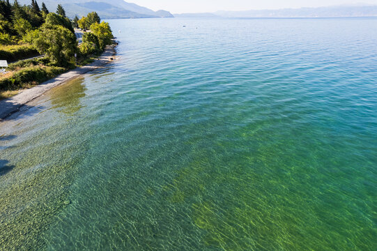 Stony shore of Ohrid lake in Summer, North Macedonia