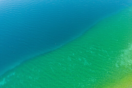 Different colors of blue in Ohrid lake in Summer of bird view
