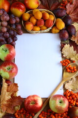 Naklejka na ściany i meble Culinary background with autumn fruits and white card