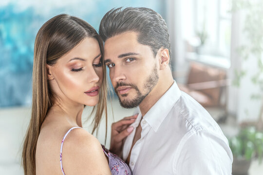 Beautiful Couple In Love Posing Together, Hugging And Dancing. Romantic Date. Real People Emotions.