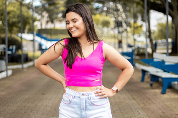 Smiling young girl posing in a park