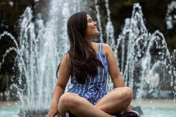 Smiling young girl posing in a park