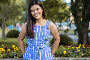 Smiling young girl posing in a park