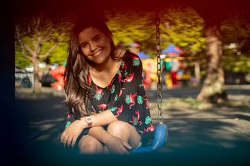 Smiling young girl posing in a park