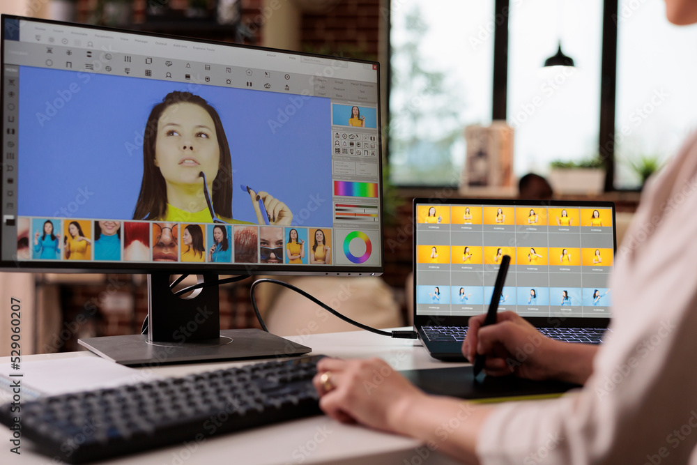 Poster creative freelancer editing picture with retouching software, using graphic tablet to edit image for