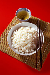 Bowl of rice with chopsticks