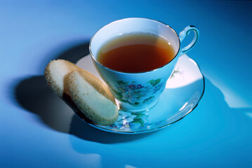 Close-up of a cup of tea and cookies