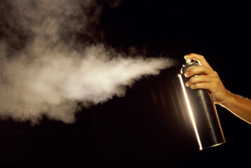 Person using a spray can
