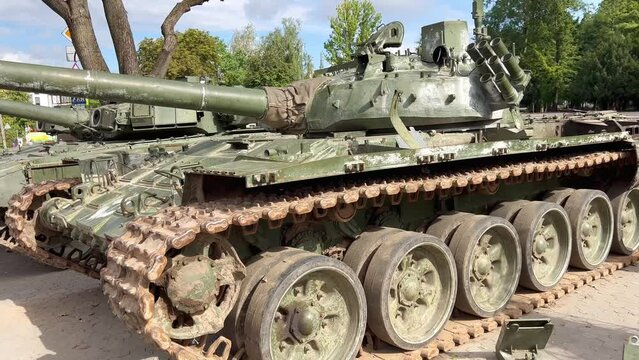 Soviet tank t 34. Russian T-74 tanks stand on the streets of Ukrainian cities. Knocked out Russian T-74 tracked tanks in the war in Ukraine. Russian knocked-out tanks on display in Ukrainian cities