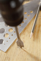 Close-up of a pencil and stencils