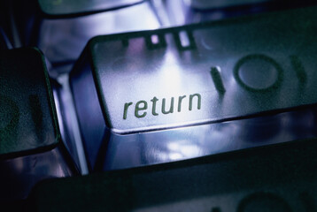 Close-up of the return key on a computer keyboard