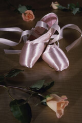 Pair of ballet slippers and roses