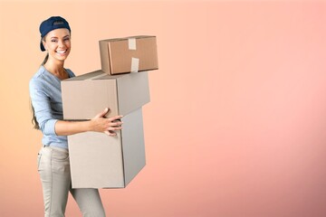 Happy girl holding package parcel boxs. Delivery courier and shipping service concept.