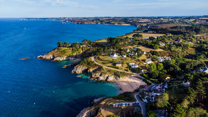 Naklejka na ściany i meble Aerial view of the coast east of Le Palais on Belle-Île-en-Mer, the largest island of Brittany in Morbihan, France - Ramonette beach surrounded by cliffs in the Atlantic Ocean