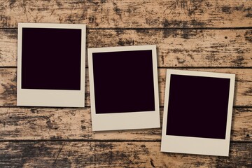 Set of blank photo frames on brown table background