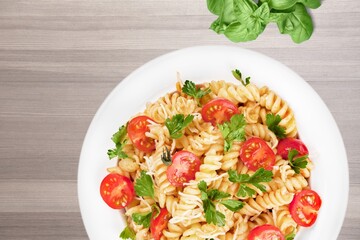 Italian Summer Salad with Pasta on plate. Fresh and healthy summer food