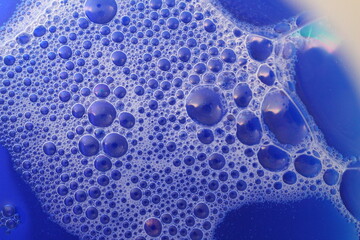 closeup of soap foam bubbles. Big and little bubbles. Routine of housekeeper