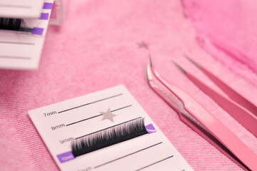 Mink lashes for eyelash extensions on pink background,beauty equipment