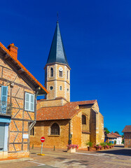 Fototapeta premium Cityscape with a view of the ancient Catholic Church of St. Martin in Romenay, France
