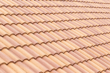 Roof tiles and sky sunlight. Roofing Contractors concept Installing House roof.