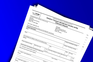 Form 15100 documentation published IRS USA 10.25.2017. American tax document on colored