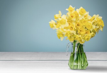 bouquet of fresh flowers on a wooden table. Neutral trendy colors interior decoration .