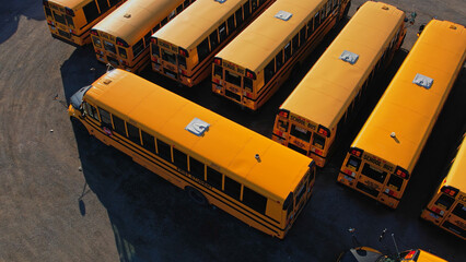 View on parked American buses in Canada waiting for the educational season. Yellow school buses in...