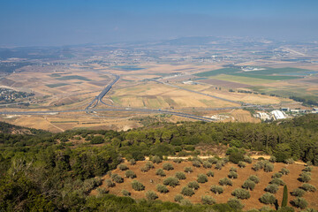 View of the Jezreel Valley in fog in winter cloudy day from Muhraqa on Mount Carmel in Lower Galilee, Israel