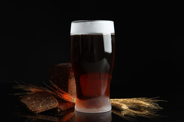 Delicious cold kvass, bread and spikes on black background - obrazy, fototapety, plakaty