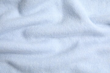 Fototapeta premium Warm cashmere sweater as background, top view
