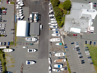 View of the parking for cars and yachts near the bay with the marina, View from above.