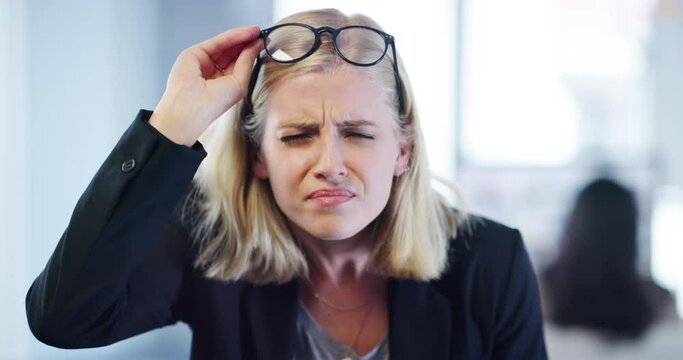 Frowning, confused and poor eyesight with business woman struggling with her eyes or bad vision while wearing glasses in a company office. Portrait of a corporate worker squinting to see clearly