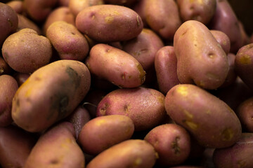 Potato texture. Potatoes in store. Sale of vegetables. Root vegetable on market.