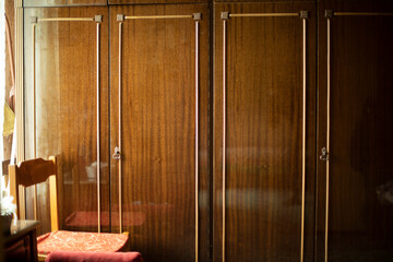 Old wardrobe in apartment. Old furniture in interior.
