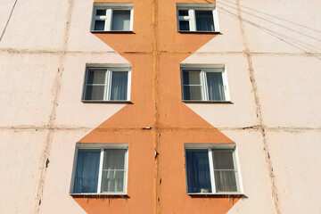 Fototapeta na wymiar Window to building. Ordinary house in detail. Residential building in city.