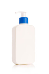 White plastic bottle pump for shampoo  isolated on white background. White dispenser bottle.