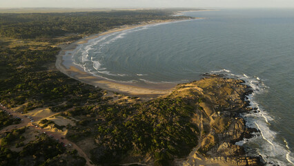 Beautiful Panoramic shot of Playa Grande beach at sunset in Uruguay. Blue water and yellow sandy beaches