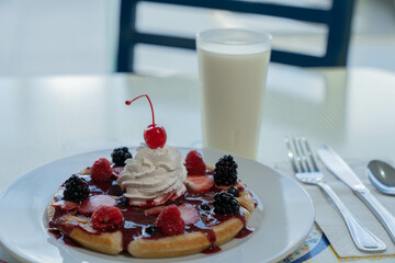 red fruit waffle with cherry