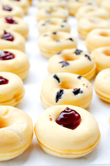 Close up of mini donut dessert homemade bakery for food backgrounds concept, vertical side