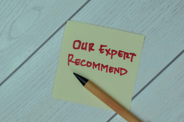 Concept of Our Expert Recommend write on sticky notes isolated on Wooden Table.